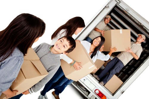 Professional movers handling furniture pick-up in Kensington storage