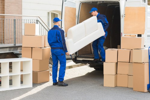 Experienced team handling furniture during a move