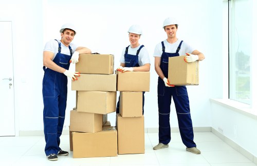 Professional packers carefully packing items in Kensington Storage facility